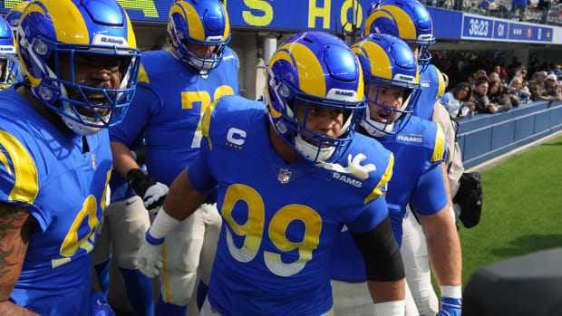 Aaron Donald and teammates prepare to run onto the field.